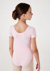 Young dancer modeling light pink cap sleeve leotard back view.