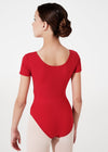 Young dancer modeling red cap sleeve leotard angled view.