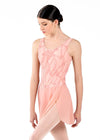 Adult dancer wearing a soft pink mesh mock wrap ballet skirt with flocking detail, front view.