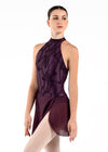 Adult dancer wearing deep plum mesh wrap ballet skirt with flocking detail.