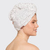 Model wearing a white microfiber hair towel wrapped securely around the head