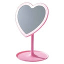A pink vanity mirror with a heart-shaped reflective surface and a round pink stand, shown against a plain white background.