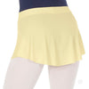 Buttercup yellow pull-on mini ballet skirt worn over tights, side view.