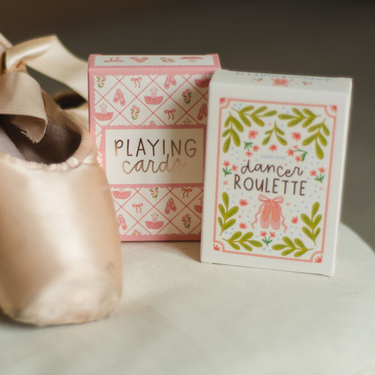 Hand holding Dancer Roulette activity card box with illustrated dance-themed design