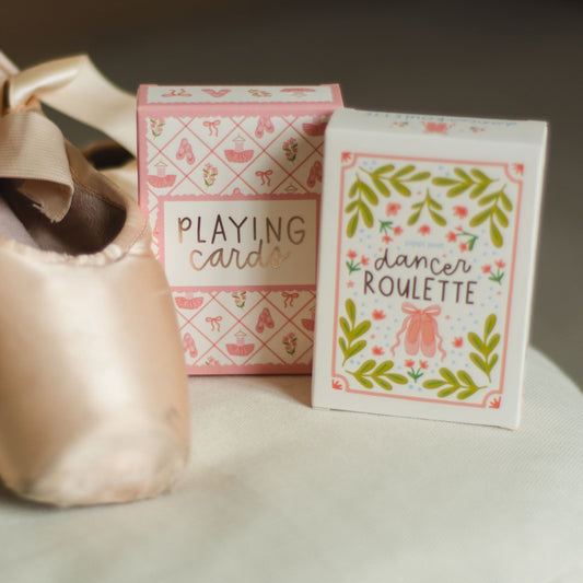 Hand holding Dancer Roulette activity card box with illustrated dance-themed design