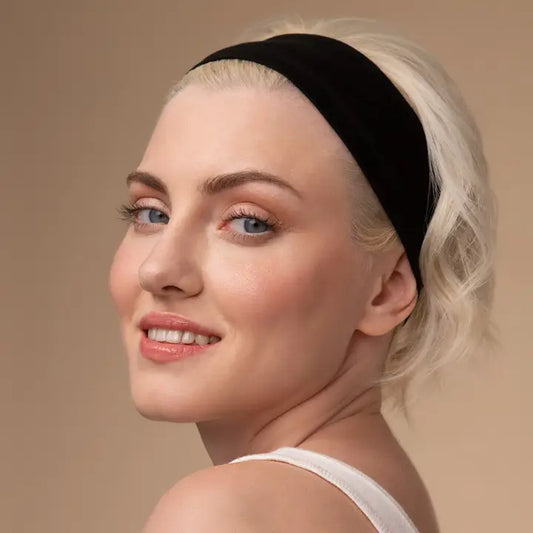 Model wearing black wide KITSCH activewear headband