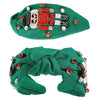 Green knotted headband with jeweled Nutcracker design