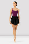 Adult dancer wearing black flocked mesh ballet skirt, front view