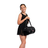 Dancer carrying black Horizon Dance Susan duffel bag