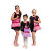 Young dancers holding pink tutu tote bags