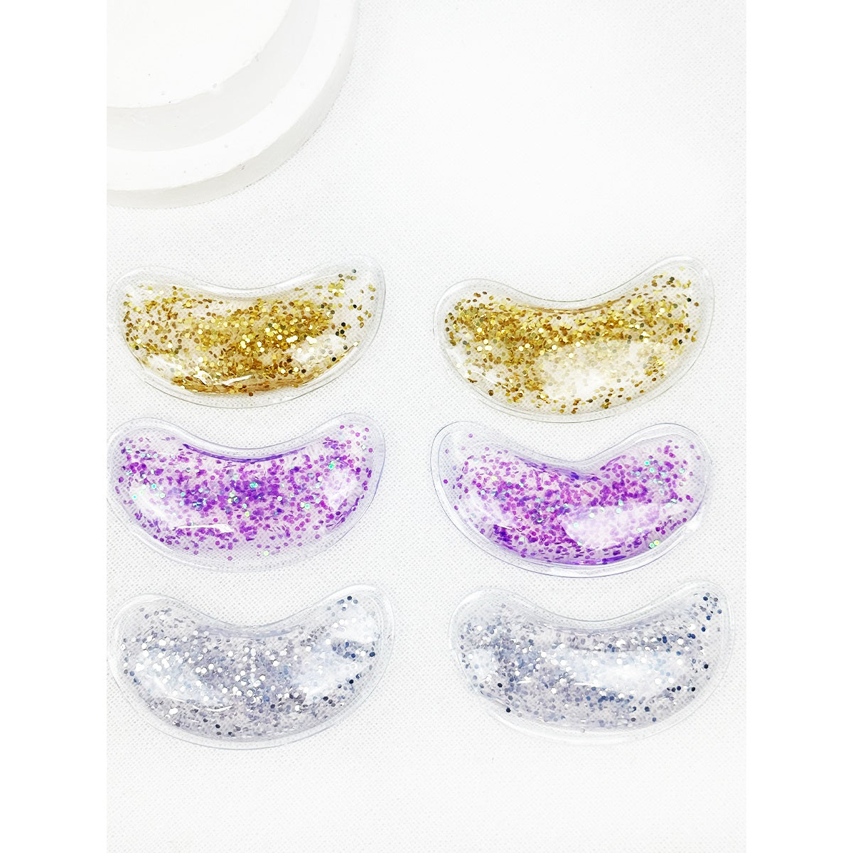 Love and Repeat reusable under-eye gel patch sets in assorted colors and packaging