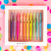 Boxed set of colorful motivational pens displayed on a pink and confetti-style background.