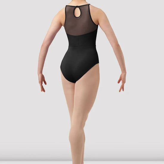Adult dancer wearing black halter leotard walking forward full body view