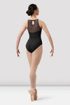 Adult dancer wearing black halter leotard walking forward full body view