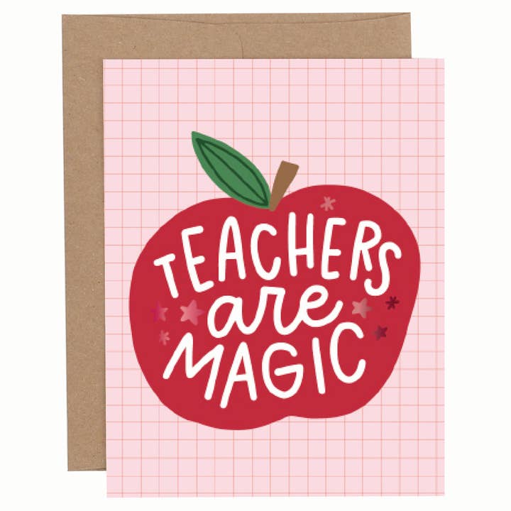 Apple-themed greeting card with red foil “Teachers Are Magic” text on a pink background, shown with a kraft envelope