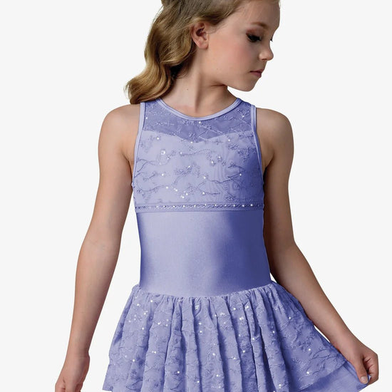 Child wearing a sleeveless halter dance dress with lace bodice and layered skirt in light purple