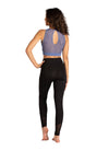 Adult tank bra top with twist detail, full-length view styled with leggings.