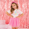 Young girl wearing pink Birthday Girl T-shirt with coordinating raspberry confetti tutu skirt