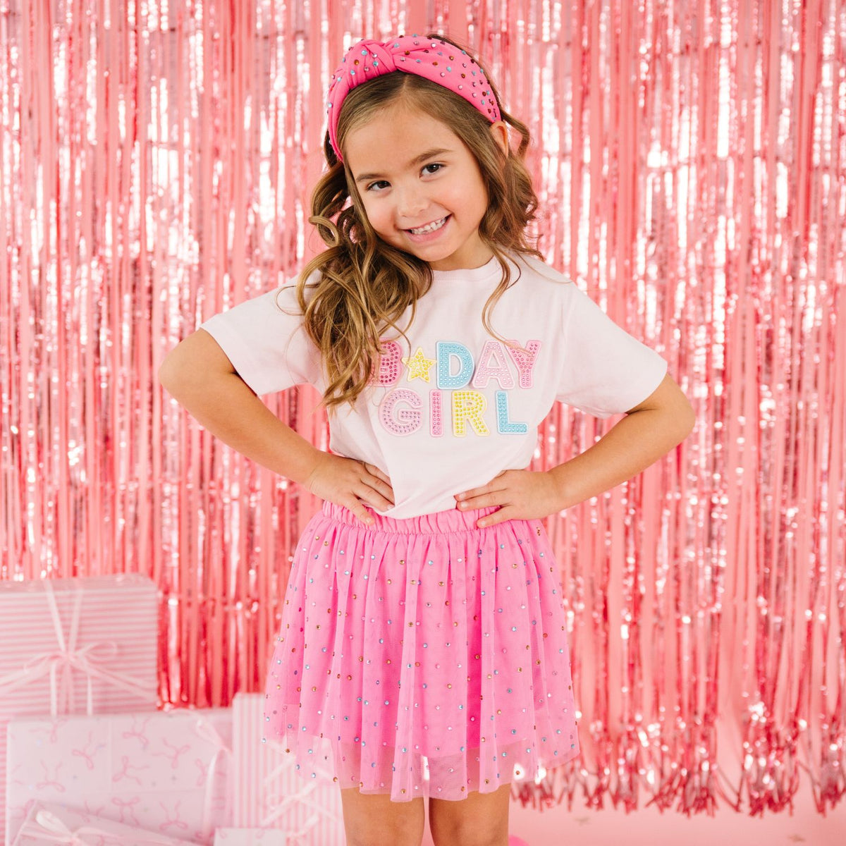 Young girl wearing pink Birthday Girl T-shirt with coordinating raspberry confetti tutu skirt