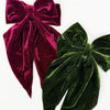 Close-up of a velvet bow hair clip with long tails