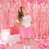 Young girl modeling pink birthday T-shirt with matching pink tutu skirt