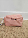 FTT logo cosmetic pouch shown closed on floor