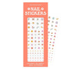 Close-up view of nail sticker sheet with assorted colorful designs
