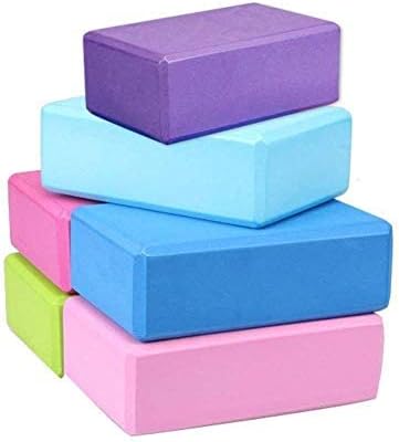 Stack of colorful yoga foam exercise blocks in purple, light blue, blue, pink, green, and rose red