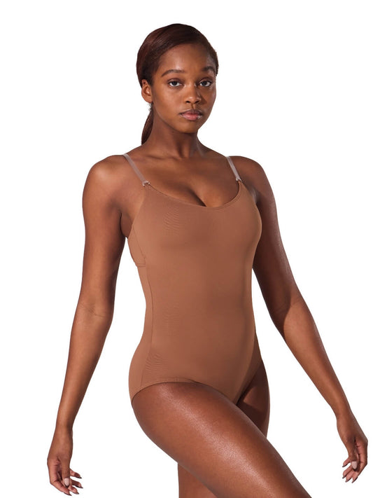 Model wearing a mocha camisole foundation leotard with clear adjustable straps and scoop front