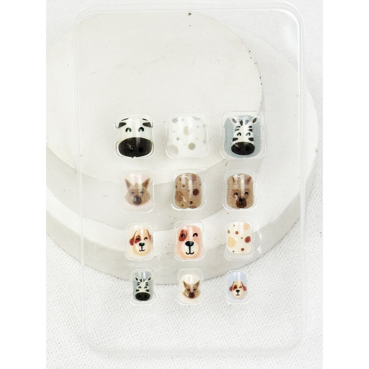 Love and Repeat kids press-on nails with small decorative details displayed on a hand