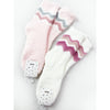 Pink and white Love and Repeat plush socks with colorful chevron patterns