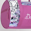 Close-up view of the striped reversible sequin side panel on a pink dance duffel bag