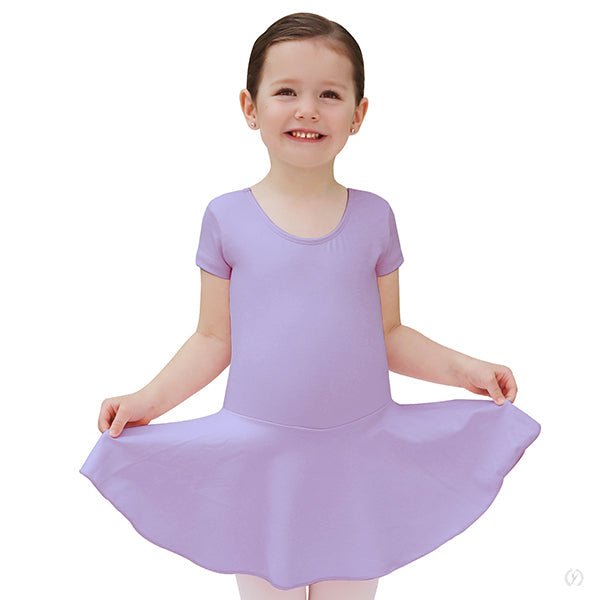 Young dancer wearing a lilac short sleeve dance dress with attached skirt seated in a ballet pose.