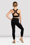 Back view of child dance crop top showing racerback mesh design