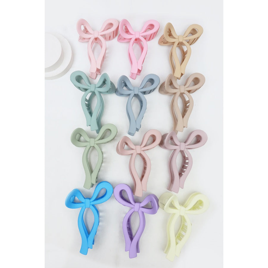 Love and Repeat pastel bow hair claws hanging in assorted colors