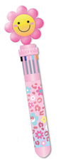 A pink flower-shaped pen with a smiling yellow face on the bloom, attached to a pink striped pen body decorated with colorful floral and animal patterns, shown on a plain white background.