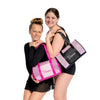 Children wearing a dance duffel bag over the shoulder for size reference