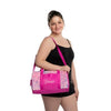 Dancer wearing a pink dance duffel bag over the shoulder