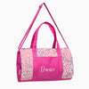 Pink dance duffel bag with iridescent sequin panels and “Dance” embroidery on the front