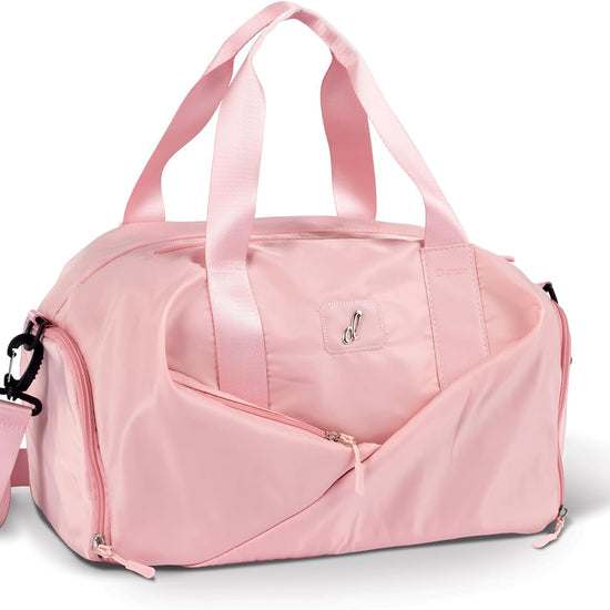 Light pink dance duffle bag with multiple compartments and shoulder strap