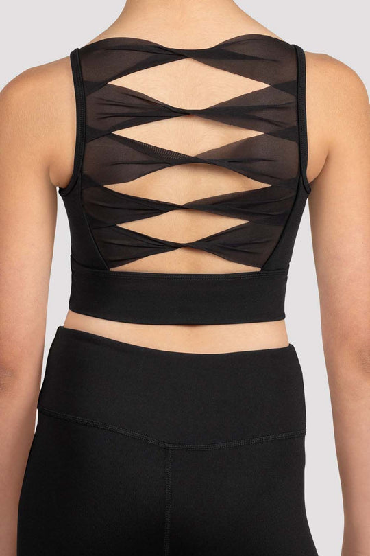 Close-up of twist-back mesh design on child dance crop top