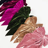 Velvet bow hair clips grouped together showing color variety