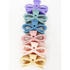 Stack of matte pastel knotted bow hair claws in mixed colors