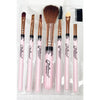 Seven-piece makeup brush set with pink handles displayed in packaging