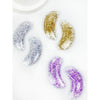 Love and Repeat reusable under-eye gel patches in silver, gold, and purple glitter finishes