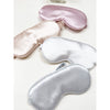 Assorted Love and Repeat satin sleeping eye masks arranged together