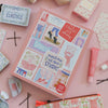 A pink gift box with dance-themed illustrations and text, surrounded by matching pink beauty and stationery items on a light pink background.