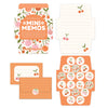 Mini memo notes and matching stickers laid out with bright designs