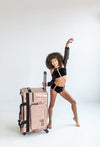Tan Glam’r Gear bag shown with a dancer model 