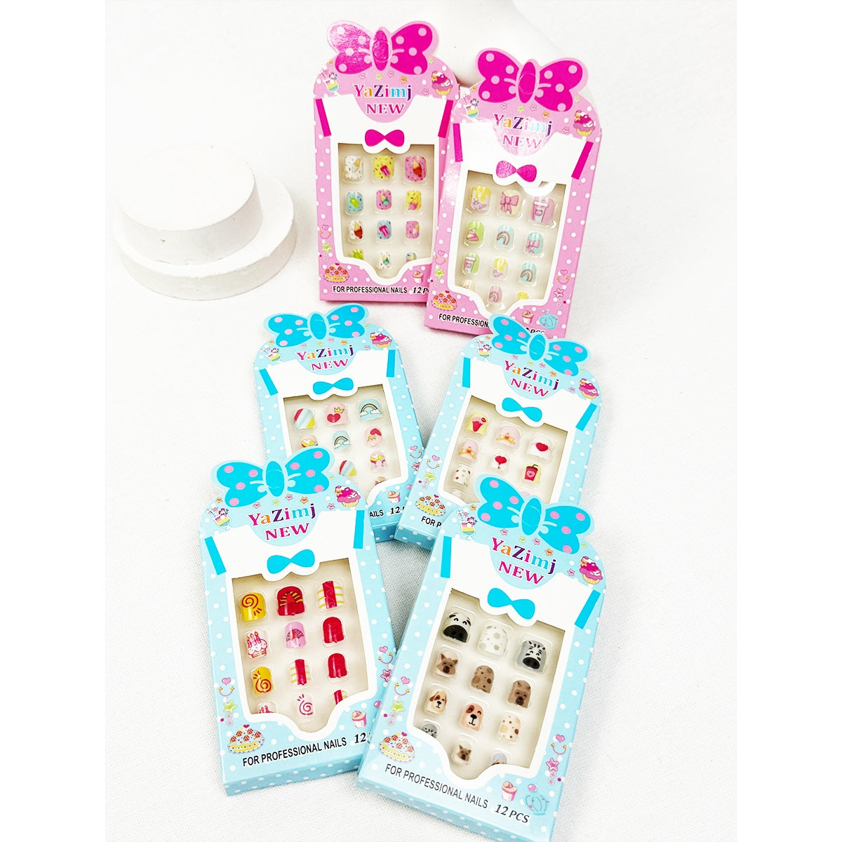Colorful Love and Repeat kids press-on nail sets in pink and blue packaging